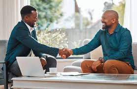 businessmen in tanzania celebrate tender win